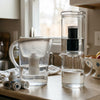 The Water Machine vs Brita: Why Glass Gravity-Fed Filtration Beats Plastic Pitchers